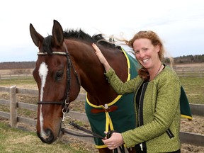 Selena O'Hanlon with her horse Foxwood High at her farm in Kingston on  April 29  after returning from the Rolex Kentucky equestrian event. (Ian MacAlpine/The Whig-Standard)