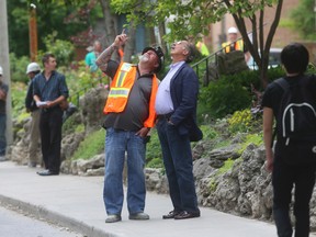 A construction worker in his 20s working on a building on St. Mary's St. fell  to his death. (JACK BOLAND, Toronto Sun)