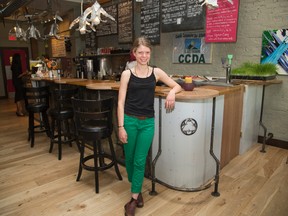 Ellie Cook, co-owner of The Root Cellar, poses in the expanded area of the popular eatery in London. The popular cafe has expanded. (DEREK RUTTAN/The London Free Press)