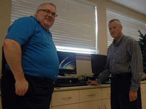 Elgin-Middlesex-London MP Joe Preston and Faith Christian Academy principal Barry Pearce stand with a computer donated to the academy through the federal Computers for Schools program. Computers for Schools takes surplus computers, repairs and refurbishes them, then donates them to schools, public libraries and Aboriginal communities. Ben Forrest/Times-Journal