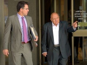 Serge Zubko, right, leaves the London Courthouse with his lawyer, Philip Milar, Monday on the first day of his trial for assaulting police in July 2013. (MORRIS LAMONT / THE LONDON FREE PRESS)
