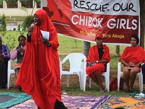 A member of the Abuja "Bring Back Our Girls" protest group addresses a sit-in demonstration organized by them, at the Unity Fountain in Abuja June 23, 2014. Picture taken June 23, 2014. REUTERS/Afolabi Sotunde