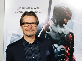 Actor Gary Oldman one of the stars of film "Robocop" arrive for the film's premiere in Hollywood, California February 10, 2014. REUTERS/Fred Prouser
