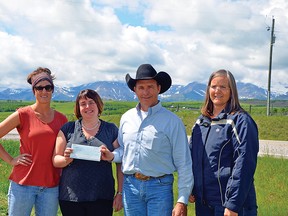 An $8,000 donation from Shell to the TBCS will help with repairs and renos at the community hall. Left to right: Alysha McNeil, Jeny Akitt, Rod Sinclair, and Melissa Friesen.