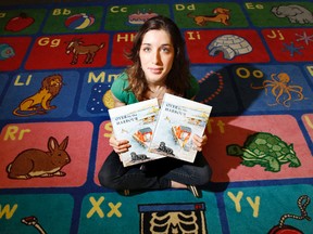 Freelance illustrator Thérèse Cilia, 33, currently lives in Belleville, Ont. and as of next week her first book collaboration, 'Over by the Harbour', will be available at Chapters at Quinte Mall. The University Of Toronto graduate is seen here in the children's section at Belleville Public Library Tuesday, June 24, 2014. - JEROME LESSARD/THE INTELLIGENCER/QMI AGENCY