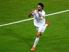 Greece's Giorgios Samaras scores a penalty against Ivory Coast's Boubacar Barry during their 2014 World Cup Group C soccer match at the Castelao arena in Fortaleza June 24, 2014. (REUTERS/Mike Blake)