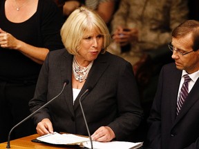 Deb Matthews (L) speaks during the swearing-in ceremony for members of the executive council of the province of Ontario at Queen's Park in Toronto June 24, 2014. REUTERS/Aaron Harris
