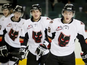 Left-winger Jake Virtanen (right) had 71 points in 71 games with the Calgary Hitmen last season. (Lyle Aspinall/QMI Agency)