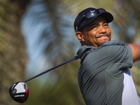Tiger Woods, who has had four surgeries to his left knee along with Achilles, elbow and neck problems, said his latest back problems were a wake-up call to take better care of himself and listen to his body. (Caren Firouz/Reuters/Files)