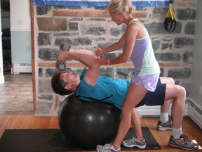 The Stability Ball Dumbbell Tricep French Press is a great exercise to challenge your core muscles while working your triceps. (Supplied photo)