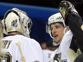 Pittsburgh Penguins goalie Marc-Andre Fleury (29) and center Sidney Crosby (87) celebrate after defeating the New York Rangers in game three of the second round of the 2014 Stanley Cup Playoffs at Madison Square Garden on May 5, 2014 in New York, NY, USA. (Brad Penner/USA TODAY Sports)