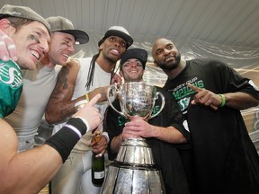 The Saskatchewan Roughriders celebrate their Grey Cup win in 2013. (Lyle Aspinall, QMI Agency)