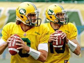 Seeing doubles. (left to right) Jonathan Crompton (8) and Mike Reilly (13) take part in an Edmonton Eskimos team practice at Commonwealth Stadium, in Edmonton Alta., on Monday June 16, 2014. 9David Bloom/QMI Agency)