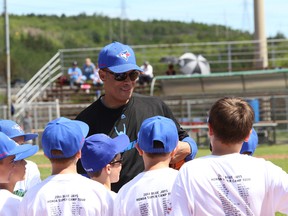 JOHN LAPPA/THE SUDBURY STAR/QMI AGENCY Former Blue Jays player Roberto Alomar works with a group of kids at a baseball camp at the Terry Fox Sports Complex in Sudbury, ON. on Saturday, June 21, 2014. Sandy Alomar Sr., and former Blue Jays greats Lloyd Moseby and Denis Boucher were also at the baseball camp.