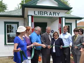 Barbara Shore, Glanworth Community Association (left); Gloria Leckie, chair, London Public Library; MP Joe Preston; Gary Goodyear, Minister of State for FedDev Ontario; Coun. Sandy White and MPP Jeff Yurek help cut the ribbon at the reopening of Glanworth Branch, London Public Library June 23, 2014.