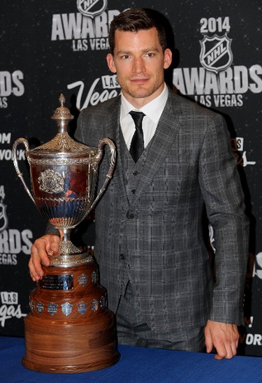Jun 24, 2014; Las Vegas, NV, USA; Edmonton Oilers forward Andrew Ference poses with the King Clancy Memorial Trophy after being recognized for leadership excellence and his humanitarian contributions to his community throughout the season during the 2014 NHL Awards ceremony at Wynn Las Vegas. Mandatory Credit: Stephen R. Sylvanie-USA TODAY Sports
