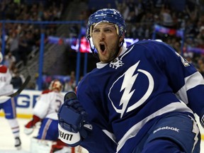 Ryan Callahan of the Tampa Bay Lightning celebrates his goal against the Montreal Canadiens at the Tampa Bay Times Forum on April 1, 2014 in Tampa, Florida. (Mike Carlson/Getty Images/AFP)