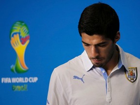 Uruguay's national soccer team player Luis Suarez arrives at a news conference prior a training session at the Dunas Arena soccer stadium in Natal, June 23, 2014. (REUTERS/Carlos Barria)