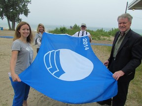 Canatara Beach's designation this year as a Blue Flag Beach, under the international environmental program, was celebrated Wednesday. The designation follows years of work by city officials, and others in the community. From left, Brett Tryon, Blue Flag program manager, Shelley Erwin with the city's parks and recreation department, Coun. Terry Burrell and Mayor Mike Bradley. (PAUL MORDEN/ THE OBSERVER/ QMI AGENCY)