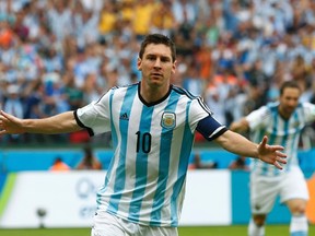 Argentina's Lionel Messi celebrates after scoring against Nigeria during their World Cup match at the Beira Rio stadium in Porto Alegre, Brazil on Wednesday, June 25, 2014. (Darren Staples/Reuters)