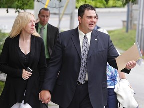 MP Dean Del Mastro and his wife Kelly arrive at provincial court on Wednesday, June 25, 2014 for the third day of Peterborough MP Dean Del Mastro's trial on Elections Canada charges. The Crown alleges Del Mastro and official agent Richard McCarthy submitted false documents to Elections Canada to cover up election overspending. Clifford Skarstedt/Peterborough Examiner/QMI Agency
