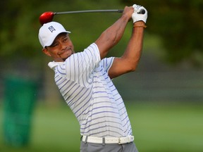 Tiger Woods tees off during a practice round for the Quicken Loans National at Congressional Country Club on Wednesday. (Tommy Gilligan/USA TODAY Sports)