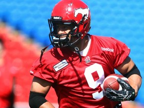 Calgary Stampeders running back Jon Cornish will continue to be the focal point of the team's offence in 2014. (DARREN MAKOWICHUK/QMI Agency)