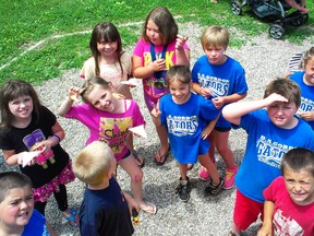 Students at D.A. Gordon public school prepare to release butterflys during the last day of the school on Wednesday. The school is closing after being open for the past 92 years.