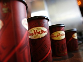 A row of Tim Hortons coffee cups are lined up for customers in this July 13, 2009 file photo. (REUTERS/Brendan McDermid/Files)
