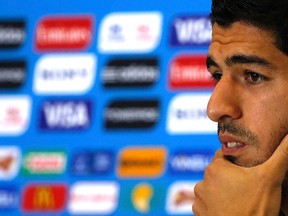 Uruguay's national soccer team player Luis Suarez attends a news conference prior a training session at the Dunas Arena soccer stadium in Natal, June 23, 2014. (REUTERS/Carlos Barria)