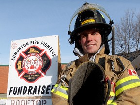 FILE: Edmonton firefighter Chris Fedor is still collecting donations in a boot, while continuing to camp out on the roof of Fire Station 2, 10217 - 107 St., during a fund-raiser for Muscular Dystrophy, in Edmonton, Alta., on Sunday Feb. 9, 2014. Fedor and firefighter Troy Farn have now been on the roof for over a week. David Bloom/Edmonton Sun