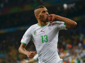 Algeria's Islam Slimani celebrates after scoring a goal during their World Cup match against Russia at the Baixada arena in Curitiba, Brazil on Thursday, June 26, 2014. (Maxim Shemetov/Reuters)