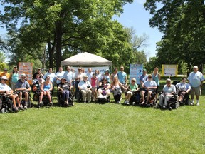 Some of the participants in the Walk with Me fundraiser for the Independent Living Centre London and Area, gather for a group shot in Greenway Park June 21. (Special to QMI Agency)
