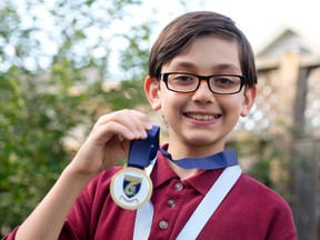 Amin Shaker shows off the gold medal he received for his performance in the Mathematica Centrum Canada-wide mathematics contest. The 11-year-old, who studies at the London Islamic School, is the only Londoner to have received high honours.
CRAIG GLOVER/The London Free Press/QMI Agency