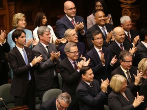 The newly appointed cabinet of Ontario Premier Kathleen Wynne applauds after her speech this week in the Legislature. Columnist Dan Brown says being named to cabinet is a dubious plum. (Craig Robertson/QMI Agency)