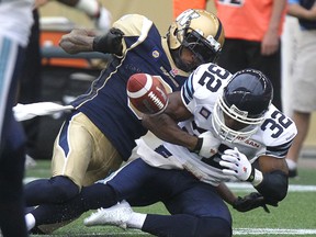 Winnipeg Blue Bombers DB Johnny Sears pulls the ball from the arms of Toronto Argonauts SB Andre Durie on June 27. (Kevin King, QMI Agency)