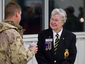 FILE: Royal Canadian Legion Branch 175 member Vicki Torrie speaks with Scott Kentish, from 1 Service Battalion, as twenty-two Canadian Forces soldiers and sailors arrived from Afghanistan at Shell Aerocentre in Leduc, Alta., on Thursday, Jan. 23, 2014. In total, 65 members arrived in Canada, including five in Winnipeg and 38 in Trenton, O.N. Ian Kucerak/Edmonton Sun