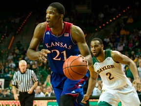 Joel Embiid #21 of the Kansas Jayhawks drives to the basket against the Baylor Bears on February 4, 2014 at the Ferrell Center in Waco, Texas. (Cooper Neill/Getty Images/AFP)