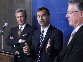 Ken Champagne (centre), chief judge of the provincial court, Glenn Joyal (left), chief justice of the court of Queen's Bench, and Richard Chartier, chief justice of court of appeals, spoke during a press conference to discuss Access to Justice Initiatives at the Law Courts Building on Friday. (Kevin King/Winnipeg Sun)