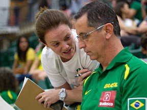 Brazil's assistant coach, Chantal Vallee, left, speaks with physical trainer "Vita" Clovis Roberto Haddad, right, during the Edmonton Grads International Classic basketball tournament at the Saville Community Sports Centre in Edmonton, Alta., on Thursday, June 26, 2014. Vallee is from Windsor, Ontario. Codie McLachlan/Edmonton Sun/QMI Agency