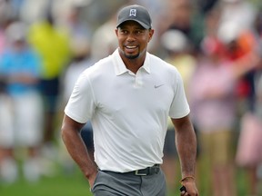 Tiger Woods walks up to the green on the first hole during the second round of the Quicken Loans National at Congressional Country Club in Bethesda, Md., on Friday, June 27, 2014. (Tommy Gilligan/USA TODAY Sports)