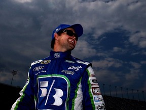 Ricky Stenhouse Jr., driver of the #17 Fifth Third Bank Ford, looks on from the grid during qualifying for the NASCAR Sprint Cup Series Quaker State 400 presented by Advance Auto Parts at Kentucky Speedway on June 27, 2014 in Sparta, Kentucky. (SEAN GARDNER/Getty Images/AFP)