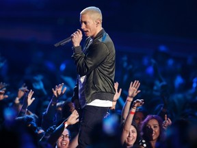 Eminem performs on stage at the 2014 MTV Movie Awards in Los Angeles, California  April 13, 2014.  REUTERS/Lucy Nicholson