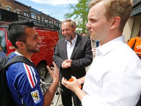 Federal NDP Leader Thomas Mulcair does some mainstreeting with Trinity Spadina NDP byelection candidate Joe Cressy earlier this month. (Michael Peake/Toronto Sun)