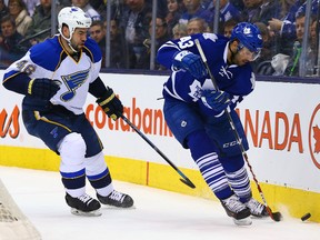 New Toronto Maple Leafs defenceman Roman Polak (seen at left for the St. Louis Blues) defends Nazem Kadri in a game last season. (Dave Abel, Toronto Sun)