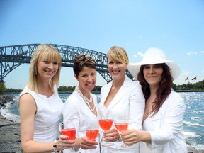 From left, organizers Kelly-Lynn Musico, Wendy Ghobril, Marinka Modderman and Tracy Justras toast the inaugural Dinner in White BlueWaterset for July 10, 6:30 p.m. to 10:30 p.m. SUBMITTED PHOTO