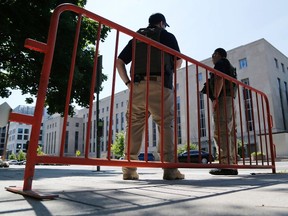 U.S. Federal Marshals patrol outside the U.S. federal courthouse in Washington June 28, 2014. Ahmed Abu Khatallah, the Libyan militia leader suspected in the 2012 attack on the U.S. diplomatic mission in Benghazi that killed four Americans, was in federal custody on Saturday morning, according to the spokesman for the U.S. attorney's office for the District of Columbia Bill Miller. Miller would not comment on where Khatallah was being held, but there was heightened security around the federal courthouse building. REUTERS/Jonathan Ernst