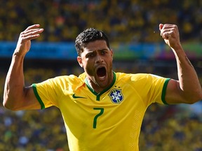 Brazil's Hulk engages the crowd for support during their 2014 World Cup round of 16 game against Chile at the Mineirao stadium in Belo Horizonte June 28, 2014. (REUTERS/Dylan Martinez)