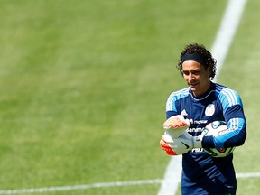 Mexico's goalkeeper Guillermo Ochoa attends a soccer training session at the University of Fortaleza ahead of their 2014 World Cup Round of 16 match against Netherlands June 28, 2014. (REUTERS/Dominic Ebenbichler)