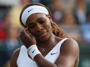 Serena Williams of the U.S. reacts during her women's singles tennis match against Alize Cornet of France at the Wimbledon Tennis Championships, in London June 28, 2014. (REUTERS/Stefan Wermuth)